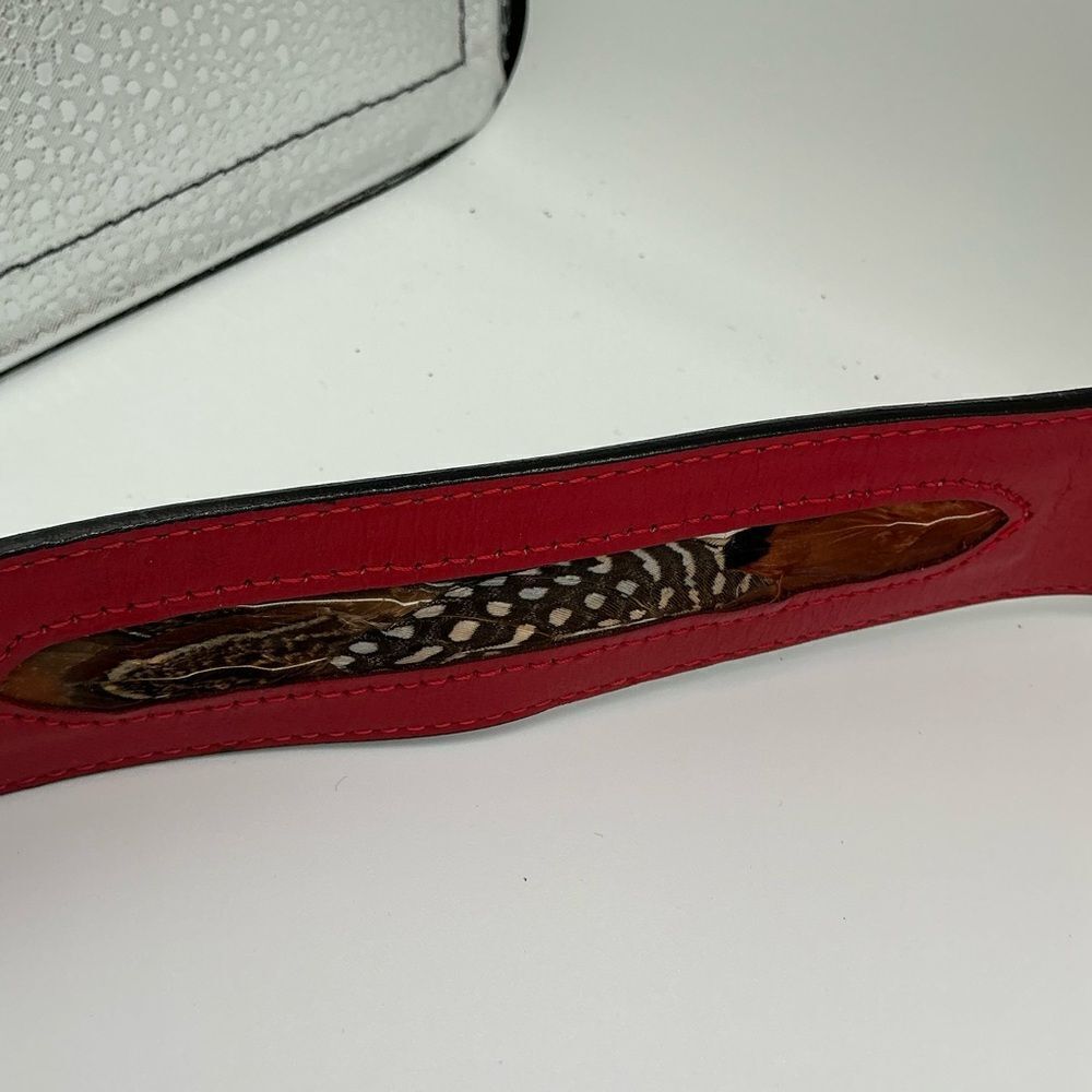 Red Rondina leather belt with feather inlays